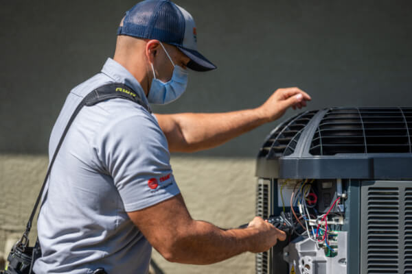 Tech working on ac unit